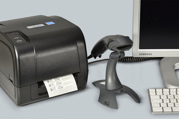 Label printer and barcode scanner at a label printing workstation